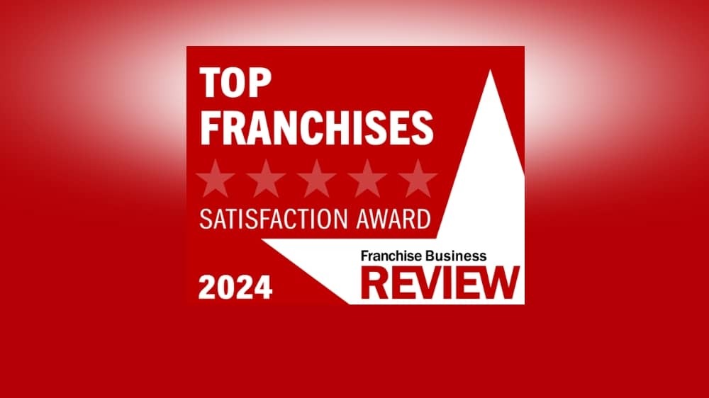 Franchise Business Review 2024 Top Franchises award badge on a red background.