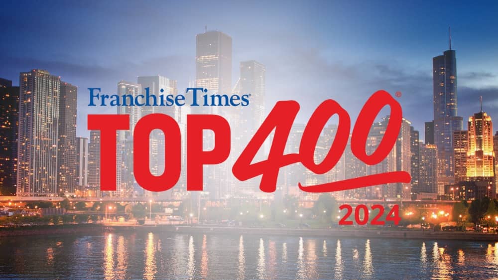 Franchise Times 2024 Top 400 Franchises award badge with a city skyline in the background