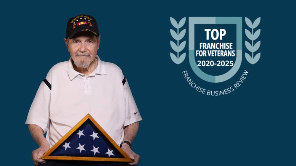 Franchise Business Review 2025 Top Franchise for Veterans award badge on a navy background next to a cutout of a veteran client