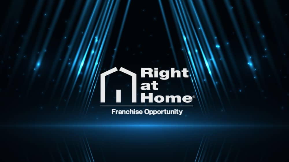 White Right at Home logo on a black background with blue lights shining in the background