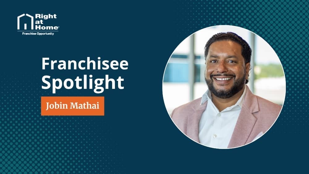 Right at Home franchise owner, Jobin Mathai, smiling during an interview with 1851 Franchise