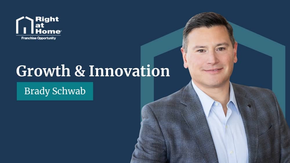 Right at Home's Chief Growth Officer, Brady Schwab, smiling during an interview with Franchising.com