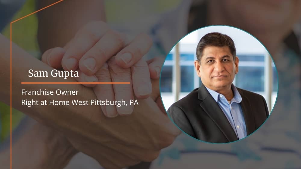 Right at Home franchisee, Sam Gupta, smiling at the camera in an interview where he discusses his franchising journey