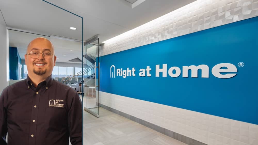 Right at Home franchsiee Albano Mahilj standing in front of a Right at Home office