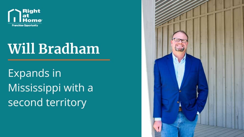 Right at Home franchisee Will Bradham standing in front of a blue background