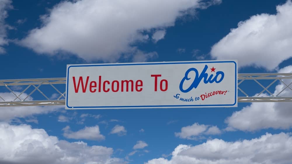 "Welcome to Ohio" interstate sign with a blue sky in the background