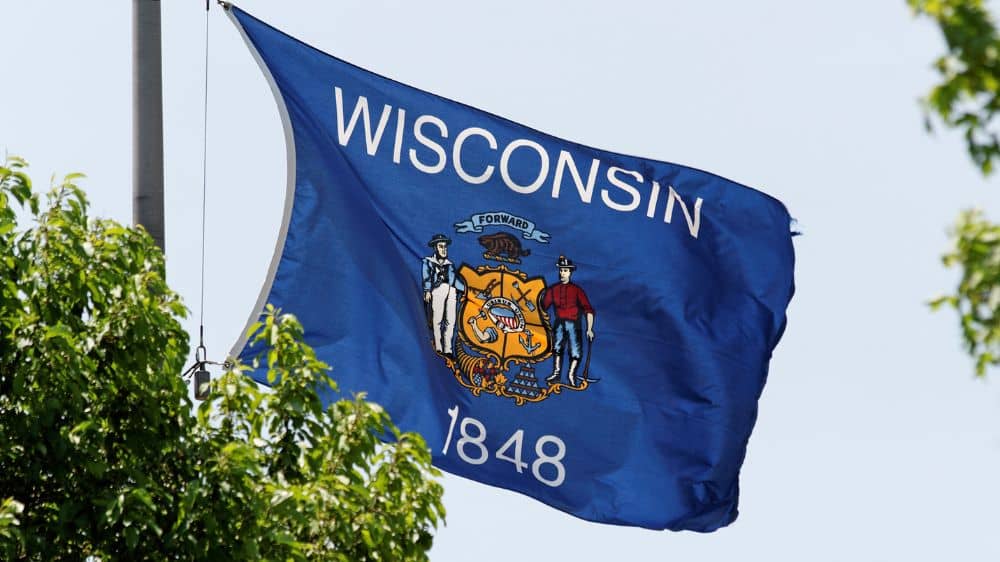 The Wisconsin state flag waving in the wind